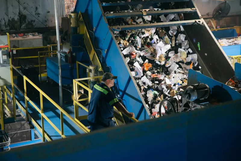 Worker in a recycling plant